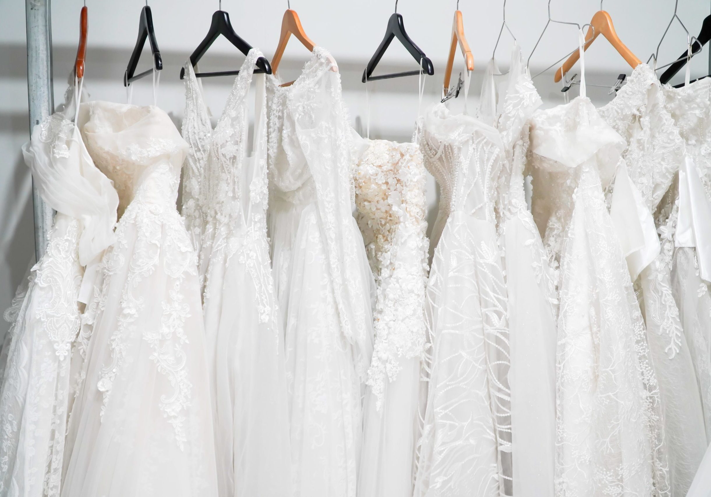 Wedding dresses hanging on a hanger. Fashion look.Beautiful bridal dress on hangers
